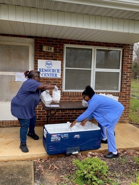 BHA and ABSS staff prepare for meal distribution at Earl-Gerow.